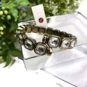 Gold tone bracelet with diamond like design
